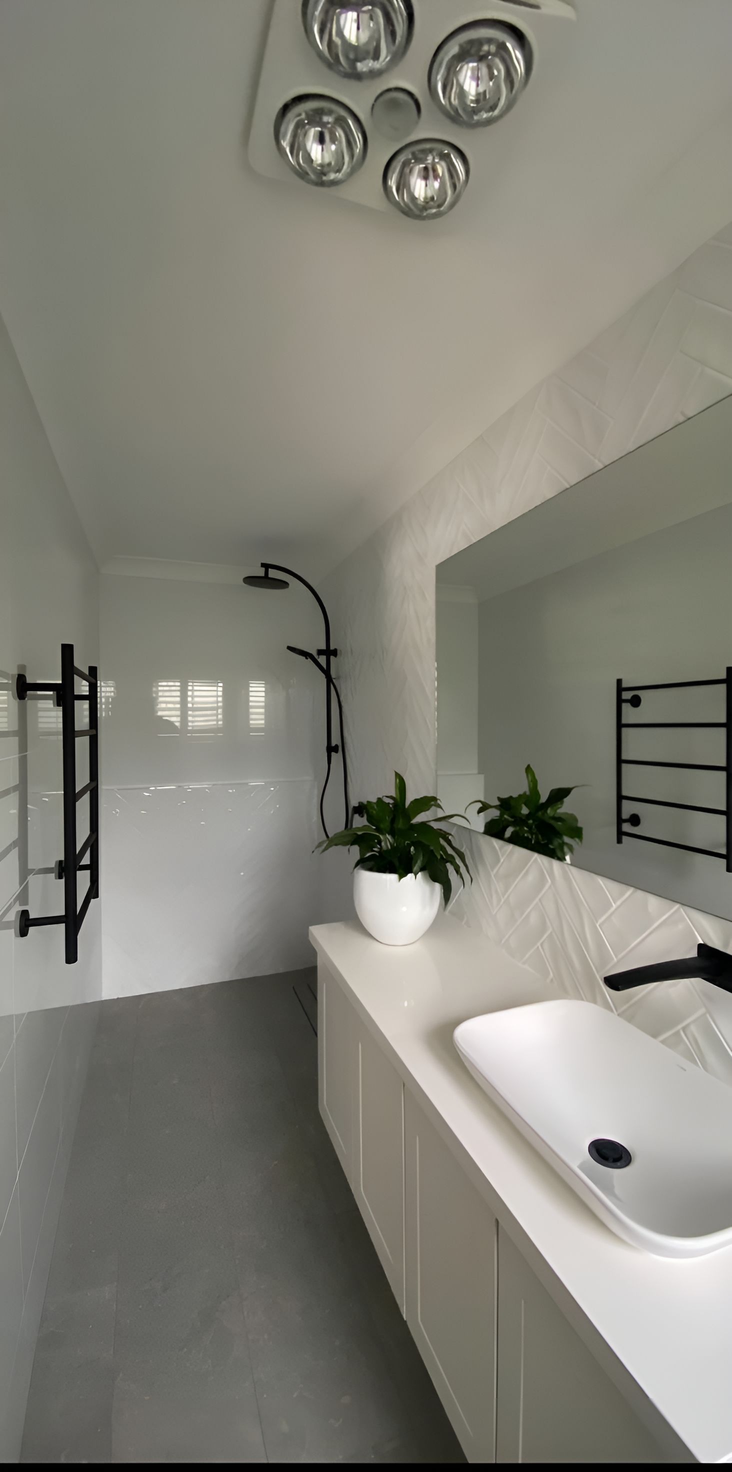 A Bathroom With A Sink , Mirror And Shower — Chris Hickling Electrical In Port Macquarie, NSW