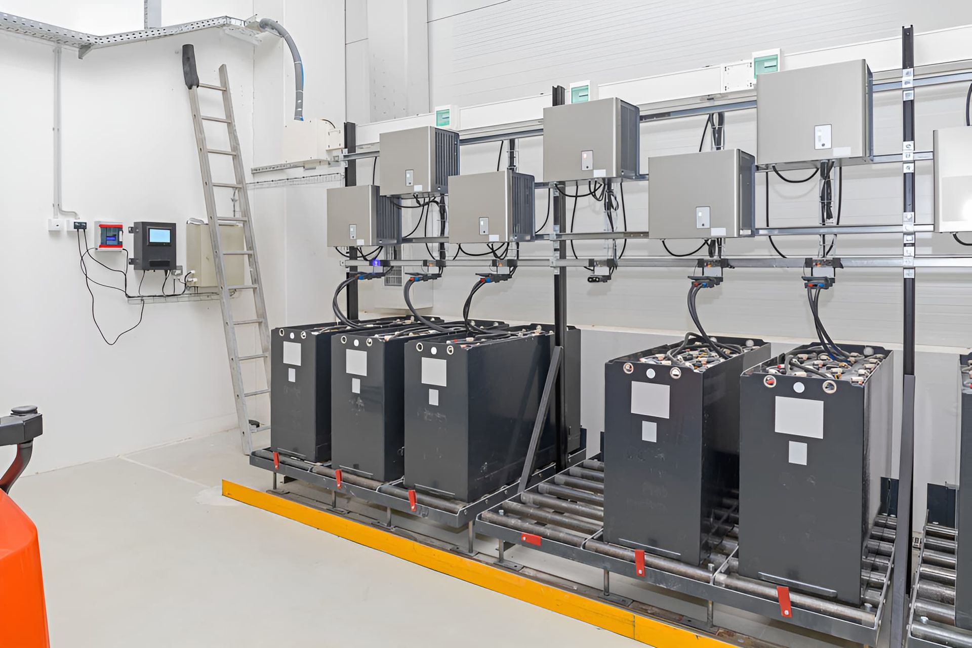 A Room Filled With Lots Of Batteries And A Ladder — Chris Hickling Electrical In Port Macquarie, NSW