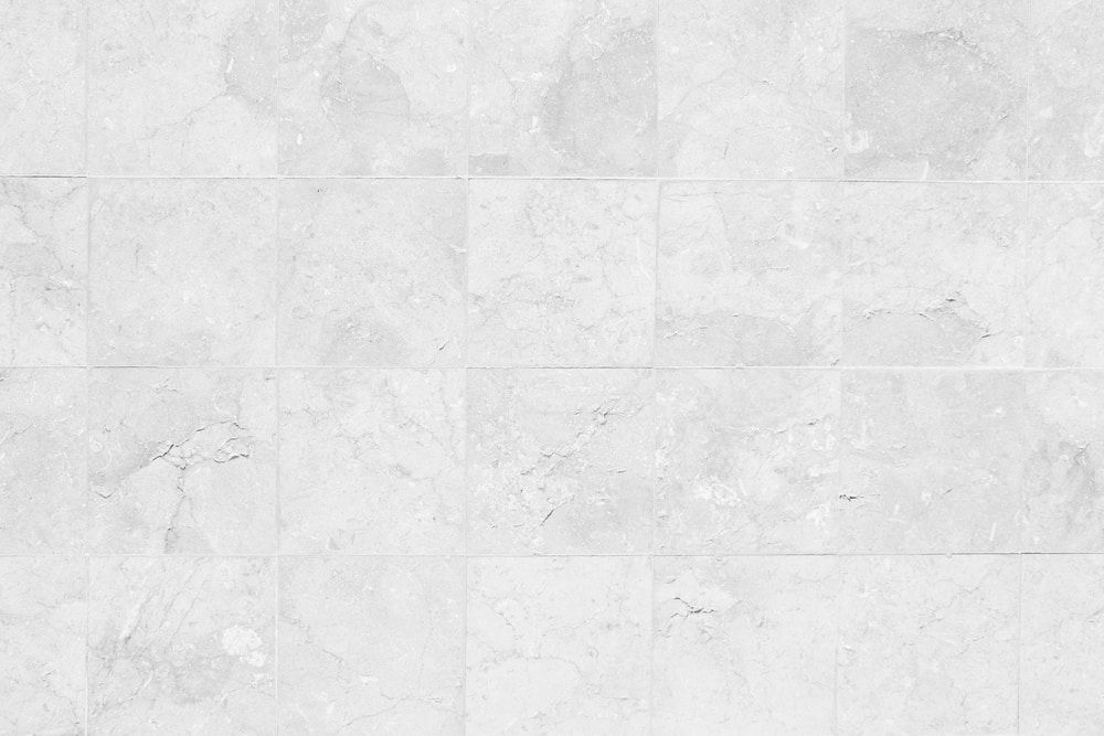 A Close Up Of A White Marble Tile Floor  — Floorgard in Wamberal, NSW