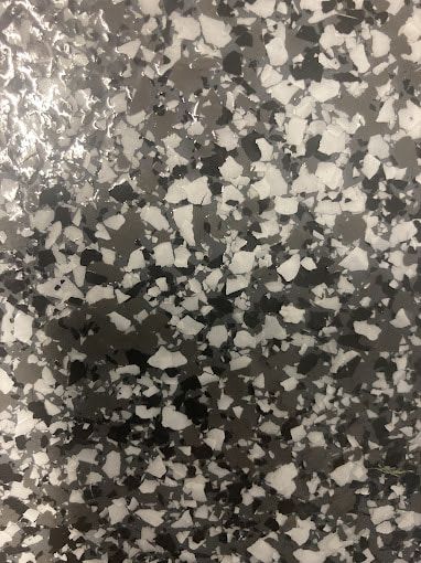 A Close Up Of A Gray And White Granite Counter Top  — Floorgard in Wamberal, NSW