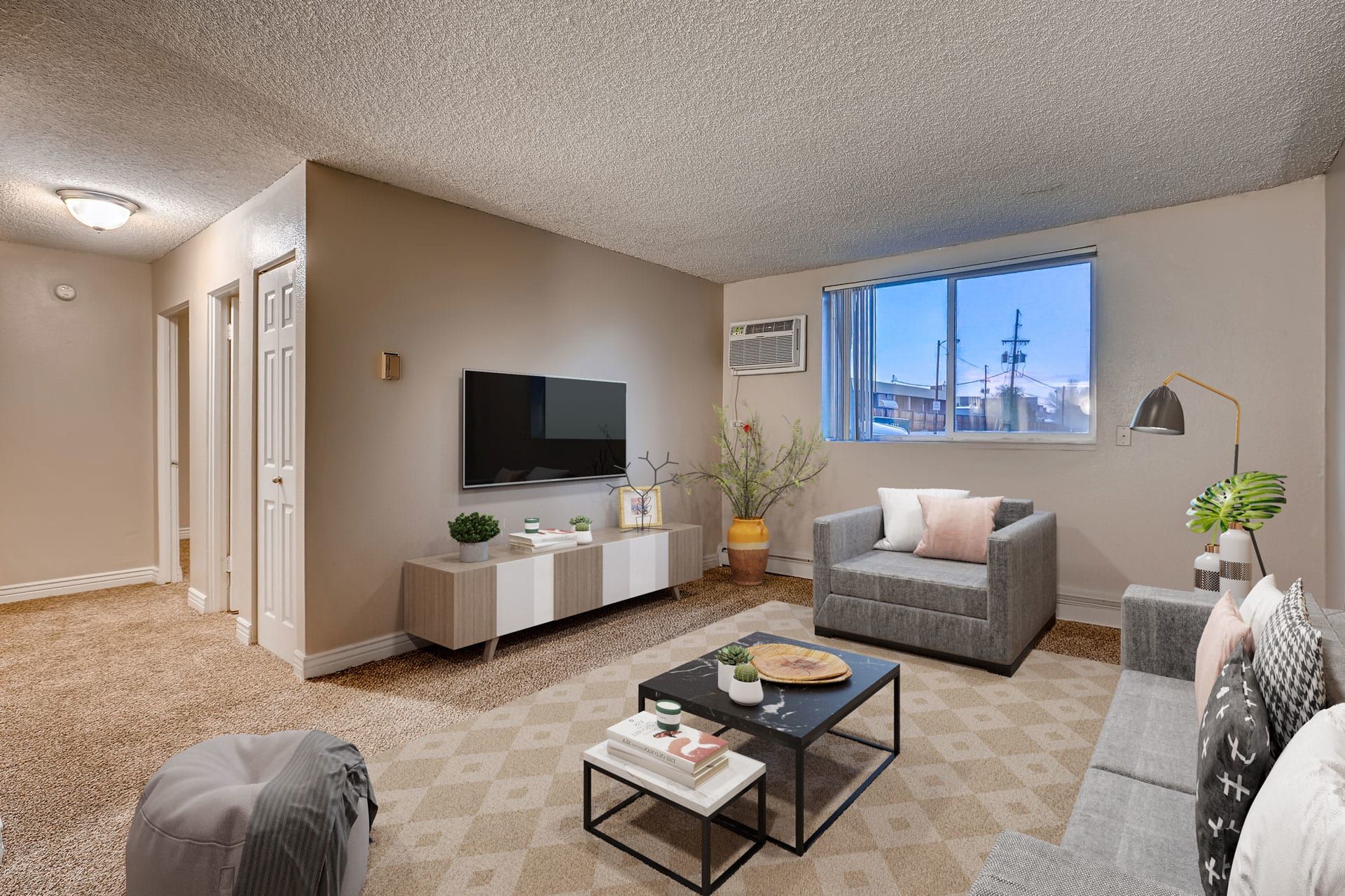 Photo showing the living room with a hallway in the background