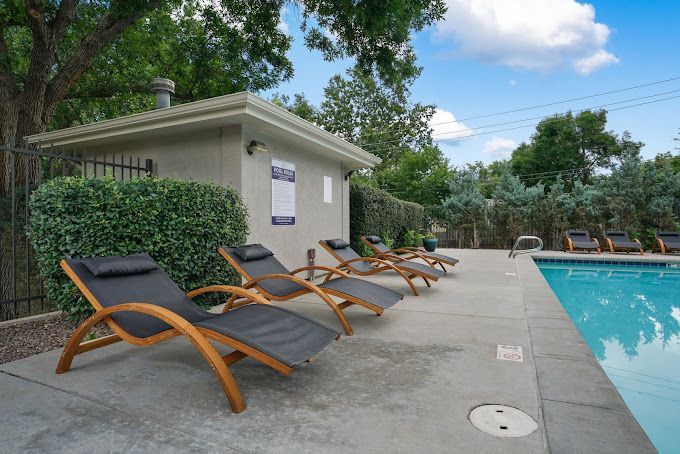 Photo showing poolside chairs