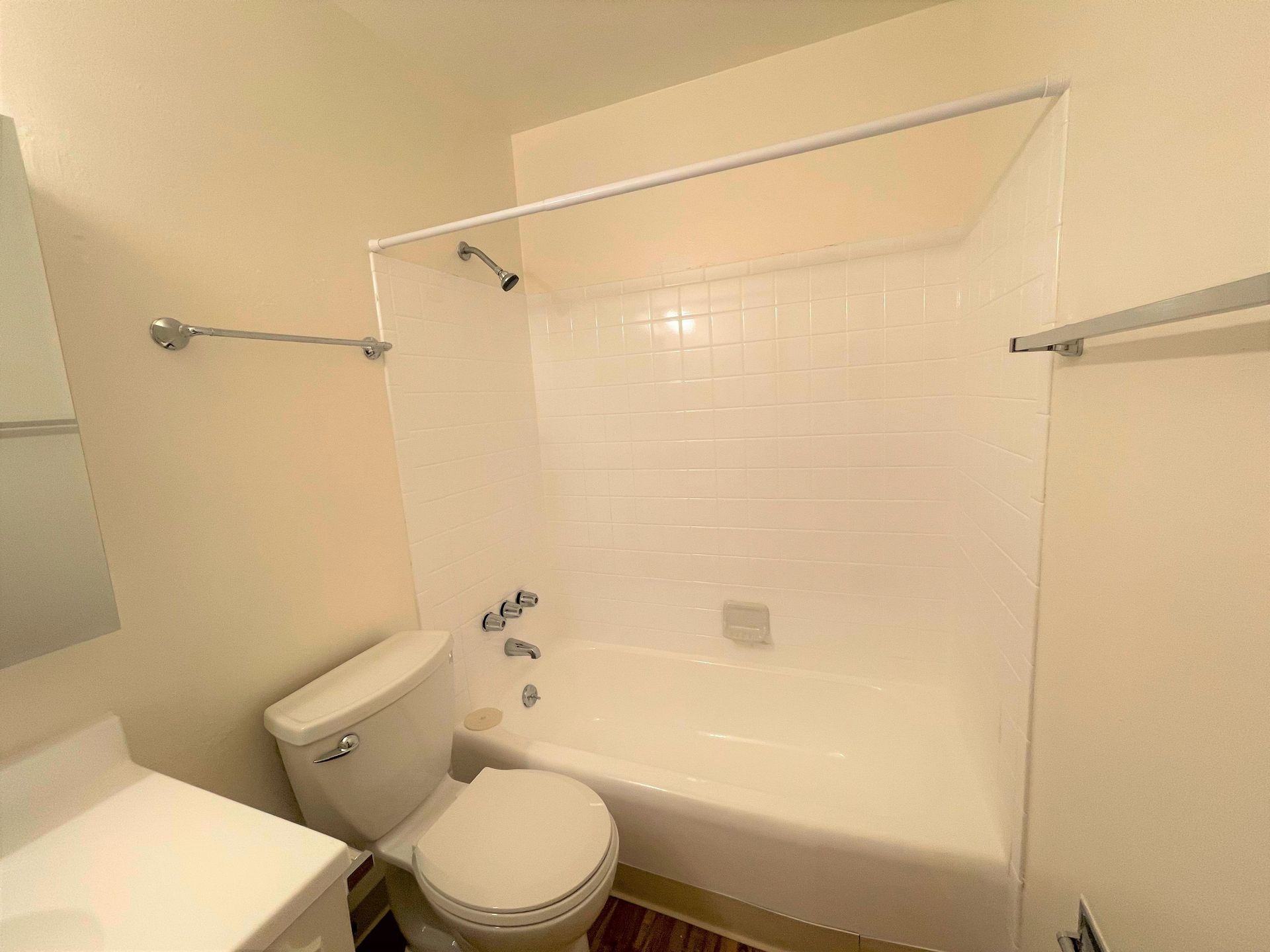 A photo showing a bathtub/shower combination