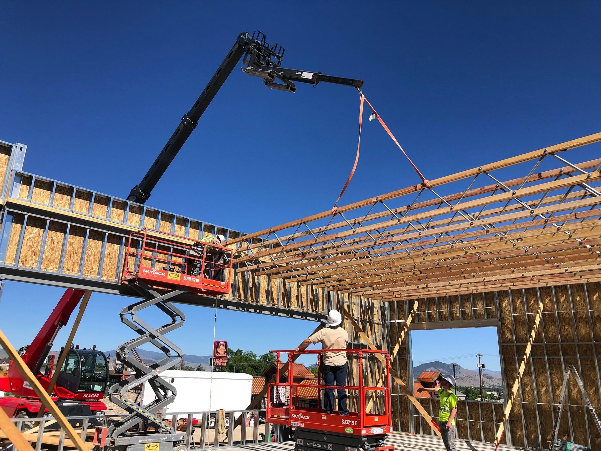 A group of construction workers are working on a building under construction.