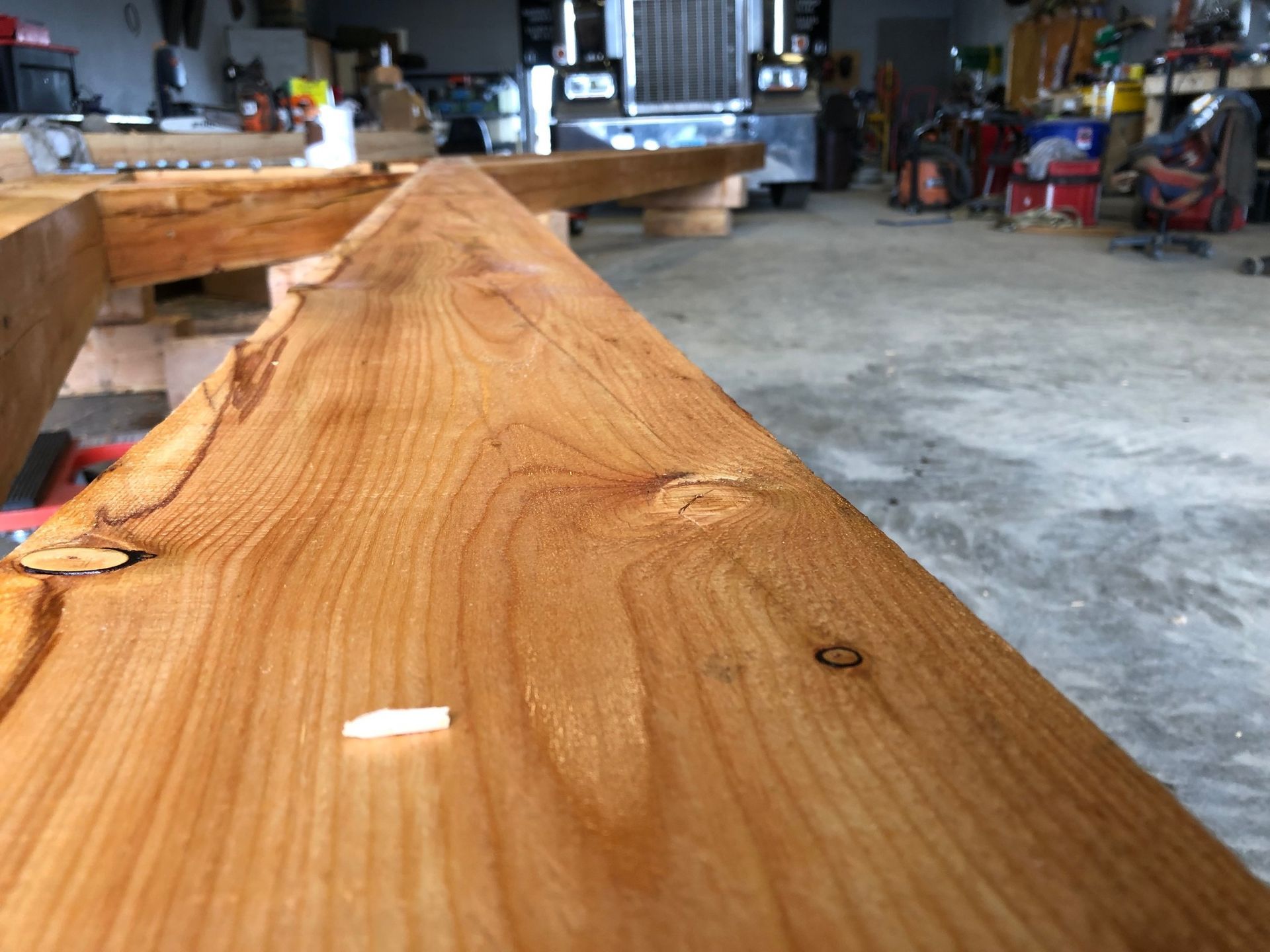 A close up of a piece of wood in a garage.