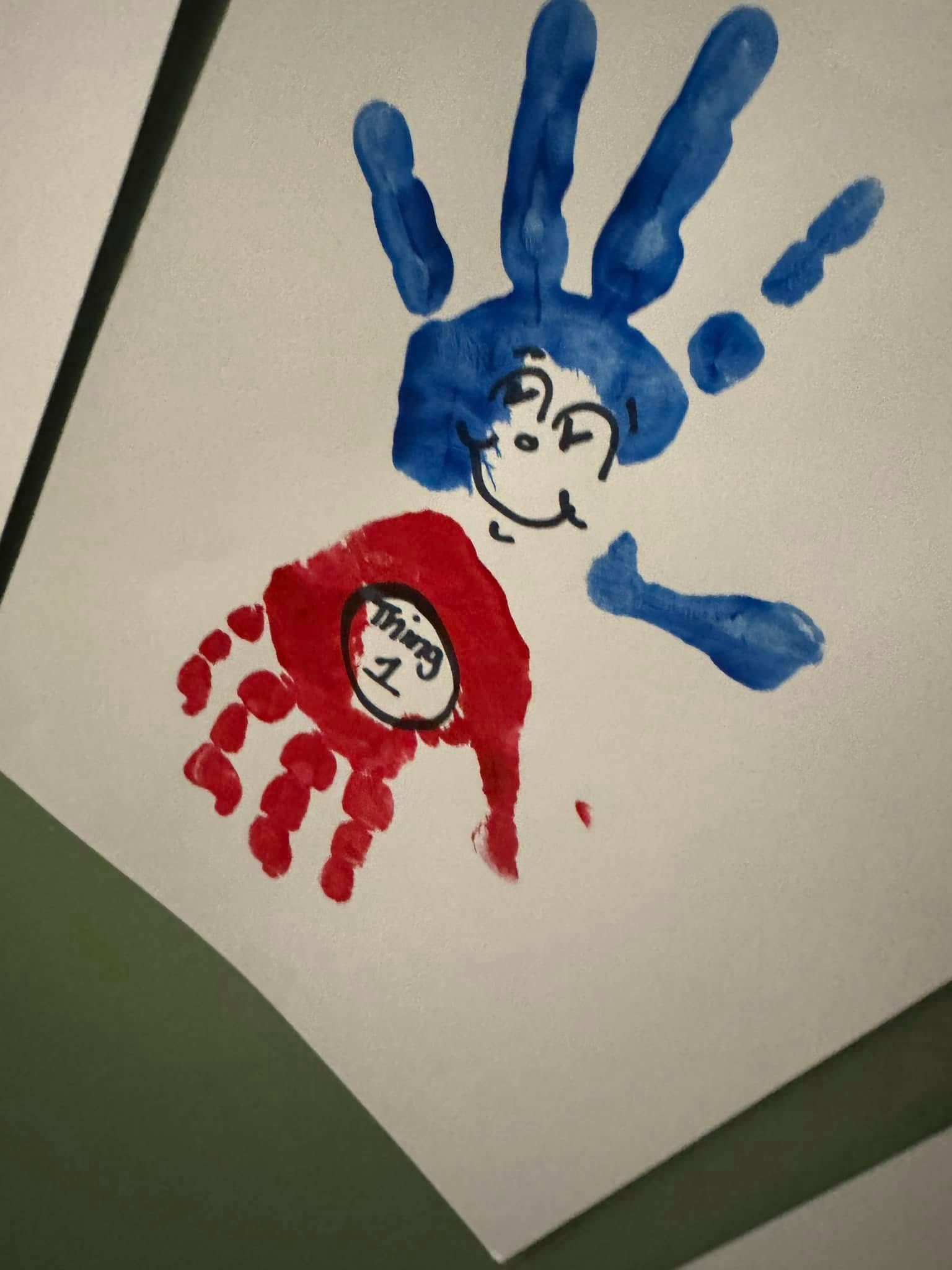 A child 's hand print of a red riding hood