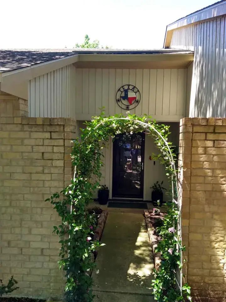 A house with a texas flag on the front of it