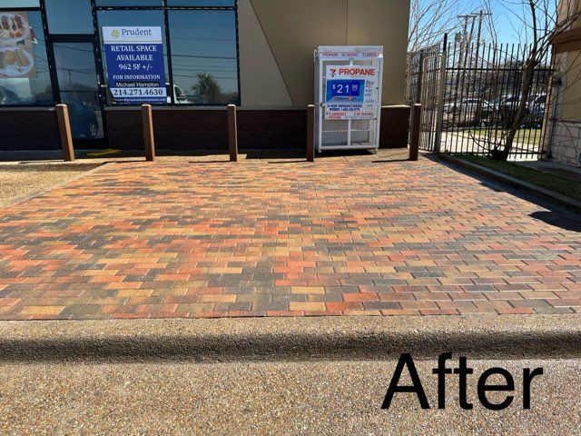 A picture of a brick driveway after being cleaned.