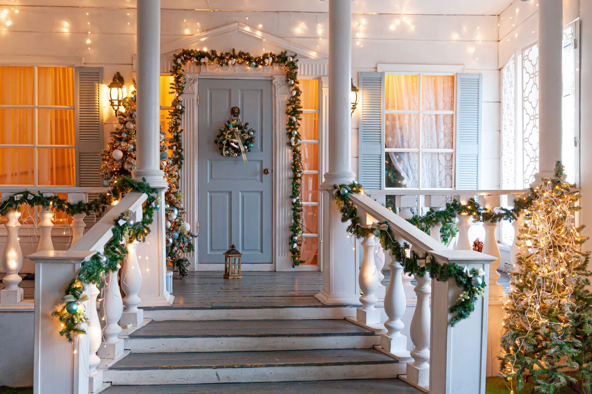 A Porch Decorated for Christmas With a Christmas Tree