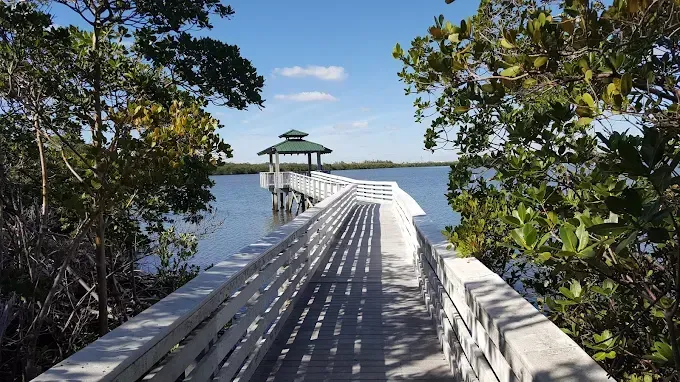 An aerial view of a beach with a city in the background.