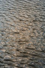 A close up of a body of water with waves