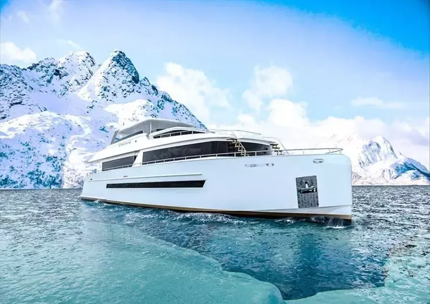 A large white yacht is floating on top of a body of water.