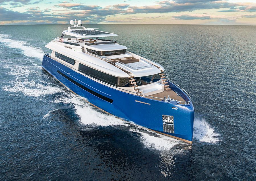 A large blue and white yacht is floating on top of a body of water.