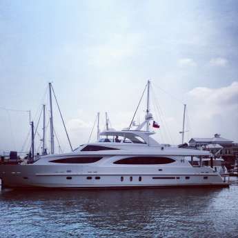 A large yacht is floating on top of a large body of water.