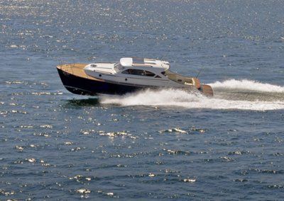 A boat is floating on top of a body of water.