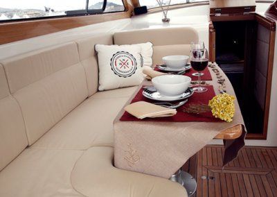 A table with plates bowls and wine glasses on it