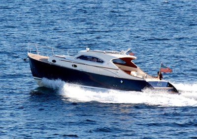 A small boat is floating on top of a large body of water.