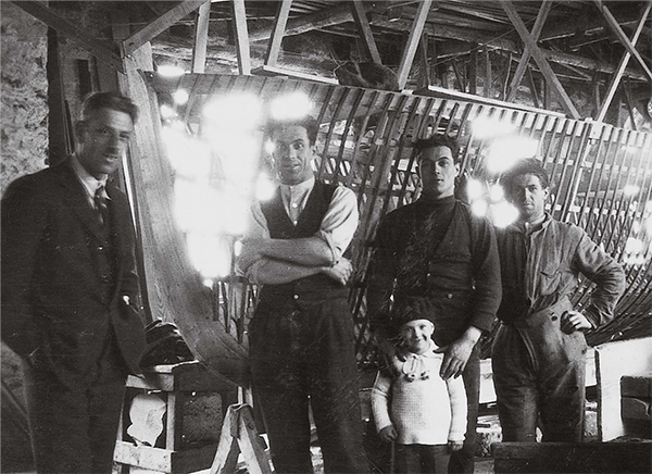 A black and white photo of a group of men standing next to each other