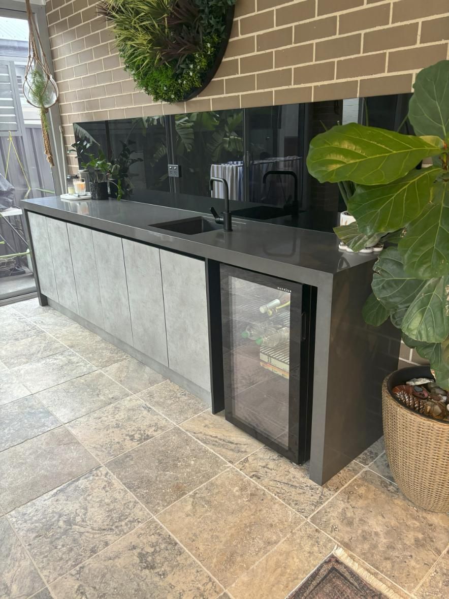 A Kitchen with A Sink, Refrigerator, and A Brick Wall — Darko's Kitchens in Barrack Heights, NSW