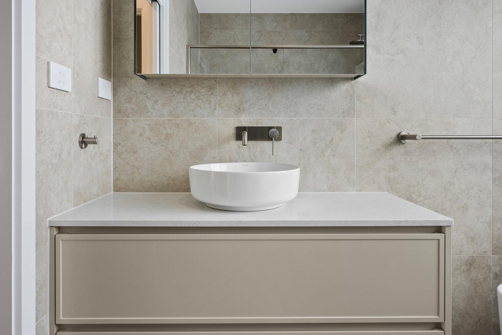 A Bathroom with A Sink and A Mirror on The Wall — Darko's Kitchens in Horsely, NSW