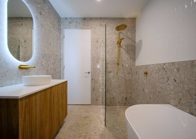 A Bathroom With a Sink, Bathtub, Shower and Mirror — Darko's Kitchens in Blackbutt, Queensland