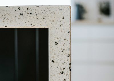 A Close Up of a White Counter Top With a Black Border — Darko's Kitchens in Kiama, NSW
