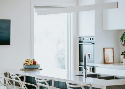 A Close Up of a White Counter Top With a Black Border — Darko's Kitchens in Kiama, NSW