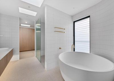 A Bathroom With a Bathtub, Sink, and Shower — Darko's Kitchens in Woonona, NSW