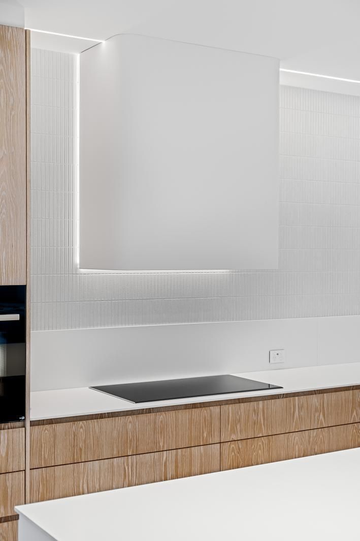 A Kitchen With White Cabinets , Wooden Cabinets, and a Stove Top oven — Darko's Kitchens in Woonona, NSW