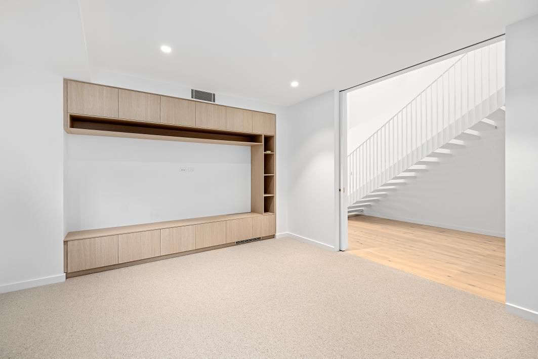 A Kitchen With White Cabinets , Wooden Cabinets, and a Stove Top oven — Darko's Kitchens in Woonona, NSW