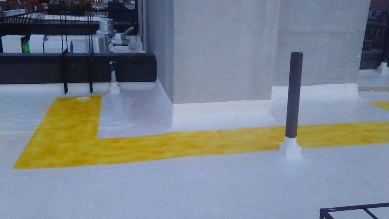 a white floor with a yellow stripe on it .