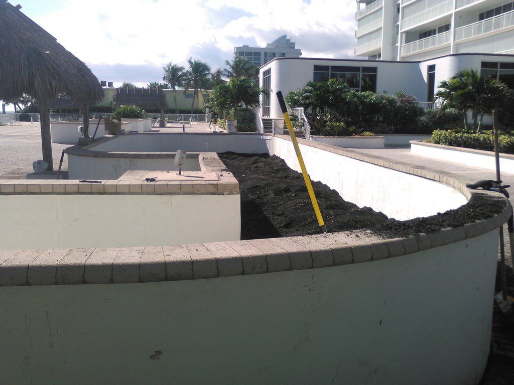 a white wall with a yellow pole in the middle of it