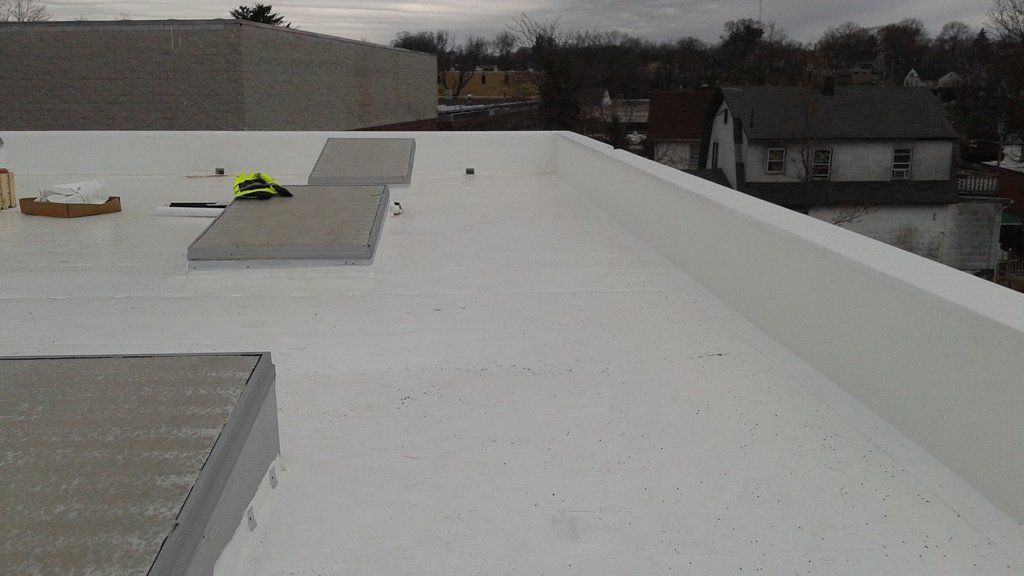 a white roof with a yellow tape measure on it .
