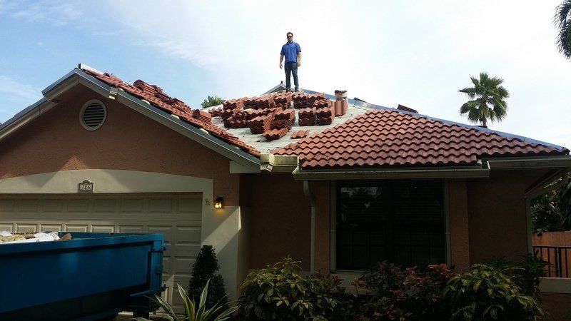 a man is standing on the roof of a house