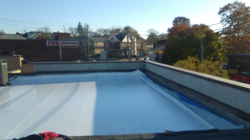 a white roof with a red sign that says gym