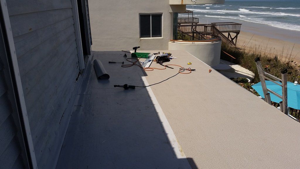 a balcony with a view of the ocean is being built .