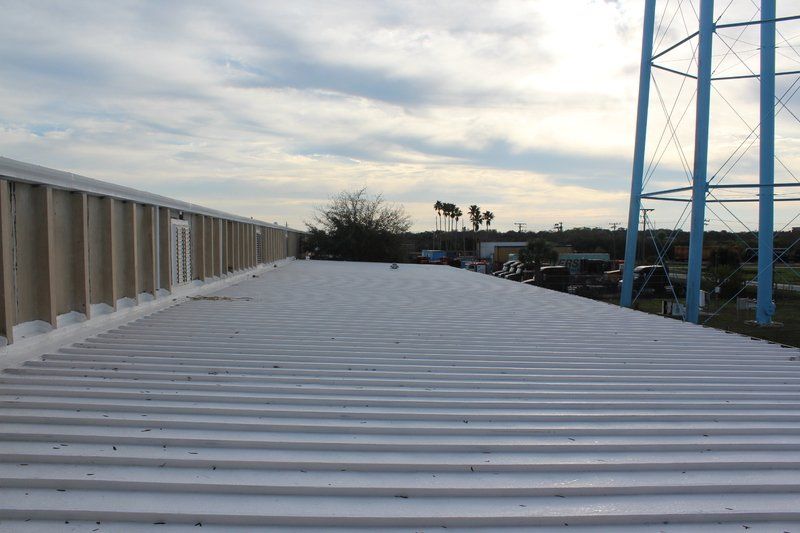 the roof of a building with a water tower in the background .