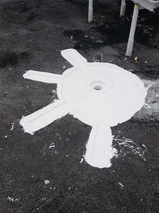 a black and white photo of a white circle on the ground
