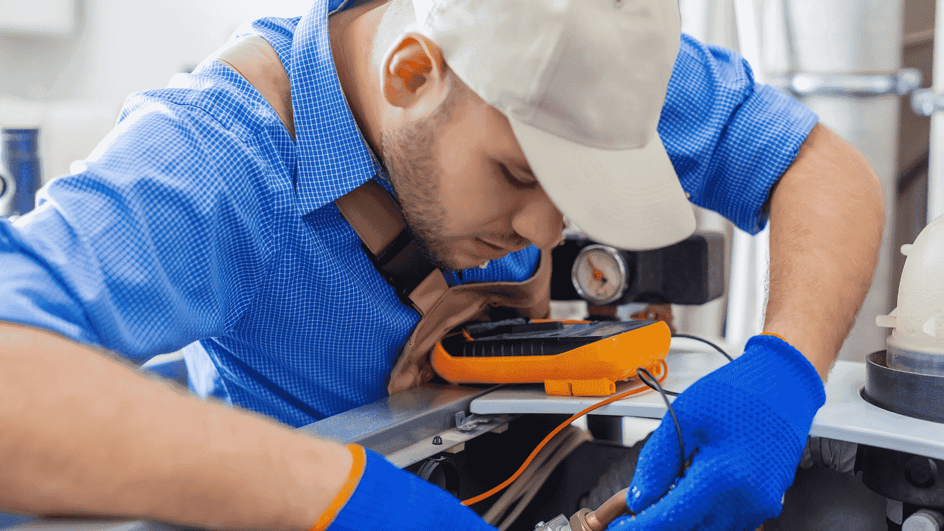 technician working on ac unit