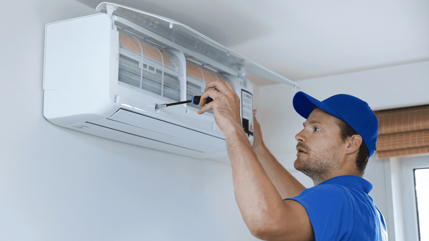 technician working on air conditioning unit