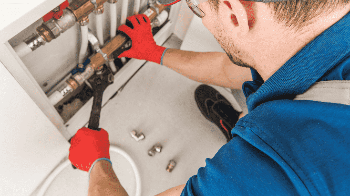technician fixing plumbing system