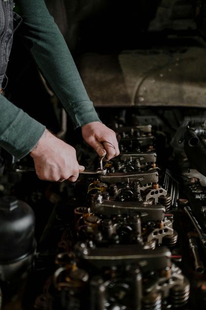 Mechanic working on engine | Gregg & Jim's Services