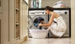 A lady in Auckland does her laundry thanks to an electrical repair