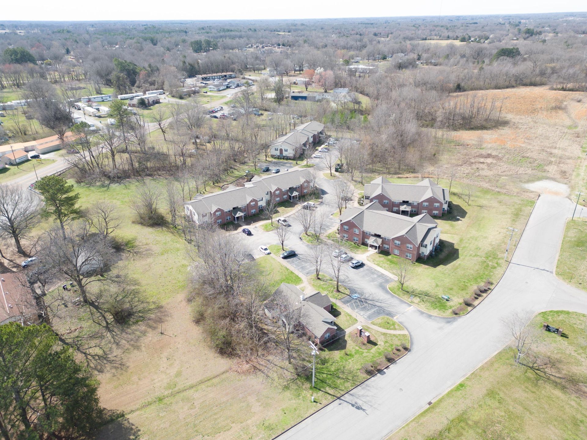 An aerial view of a residential area with houses and trees