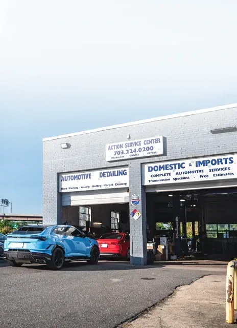 A car dealership with cars parked in front of it. | Action Service Center