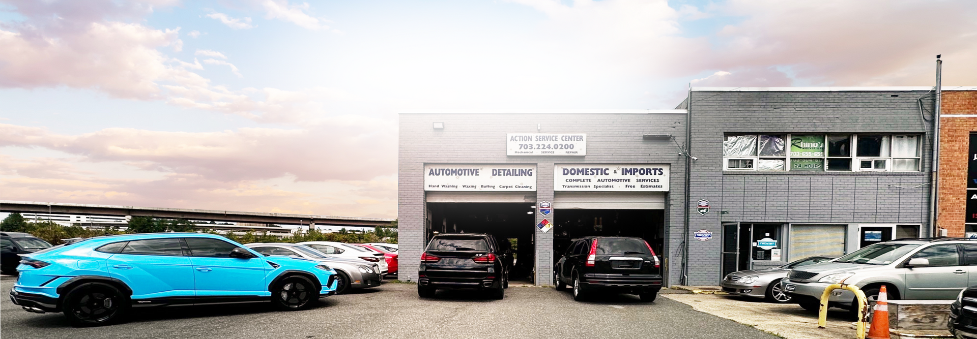 A lot of cars are parked in front of a building. | Action Service Center