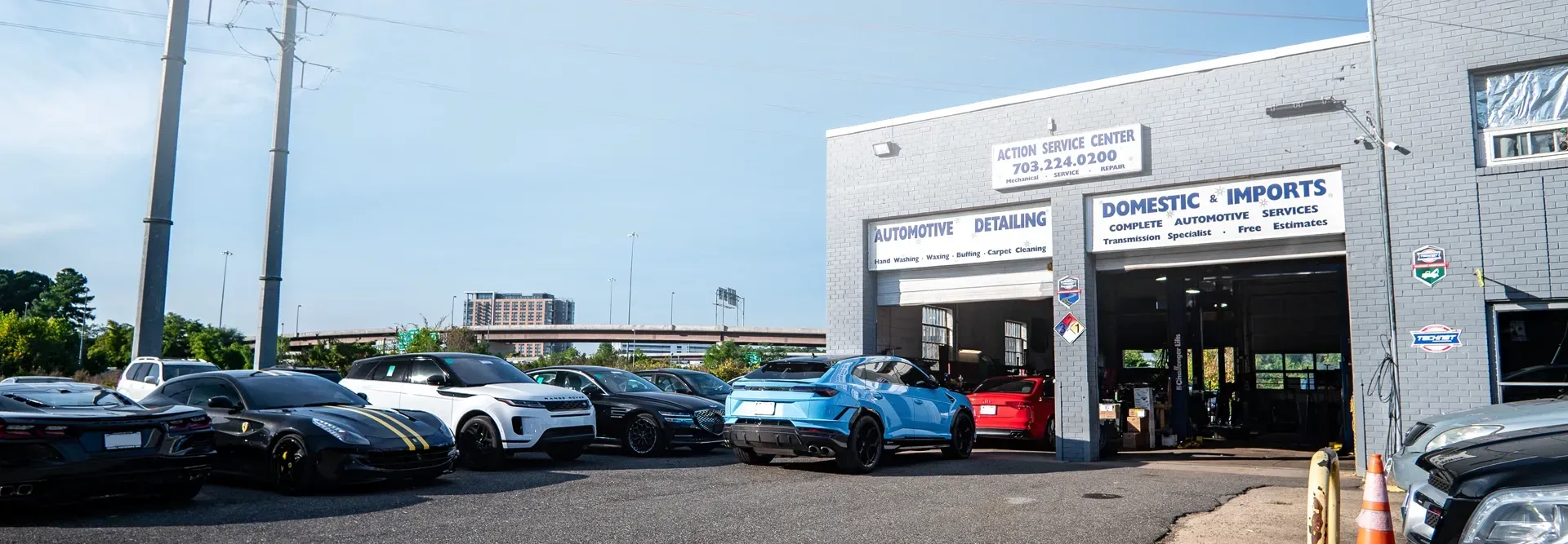 A lot of cars are parked in front of a building. | Action Service Center