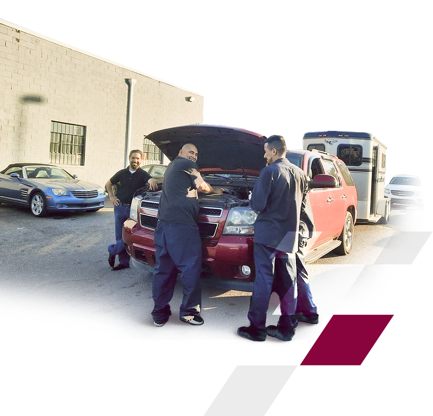 A group of men looking under the hood of a car | Action Service Center