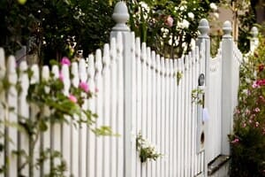 Family Walking Along a Fence — Fence & Gate Specialist in Staten Island, NY
