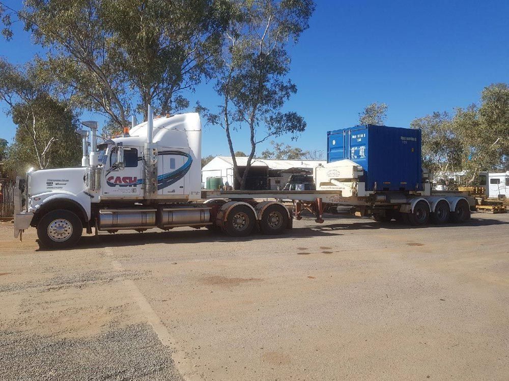 White Semi-Truck with Blue Container on Trailer — Central Australian Sidelifter Haulage in Ciccone, NT